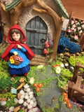 Little red riding hood in fairy garden