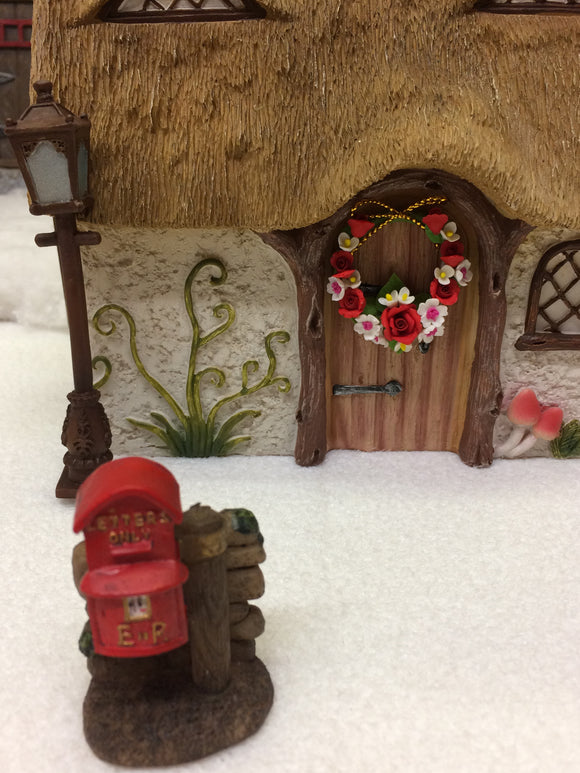 Thatched cottage with post box