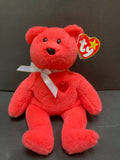 Red beanie baby with silver bow heart on his chest