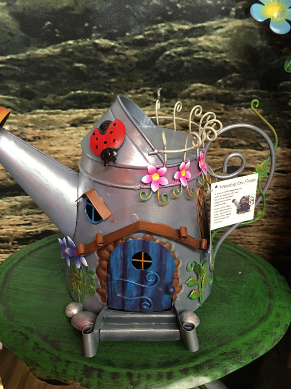 Metal watering can fairy house