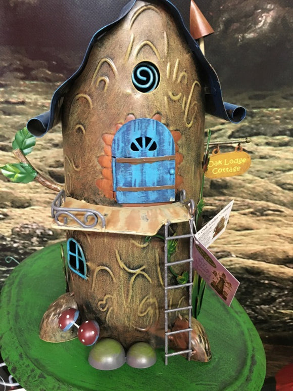 metal pixie house, in the style of a tree, with a ladder leading to door H:28cm