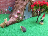 Tiny ceramic animals in a fairy garden