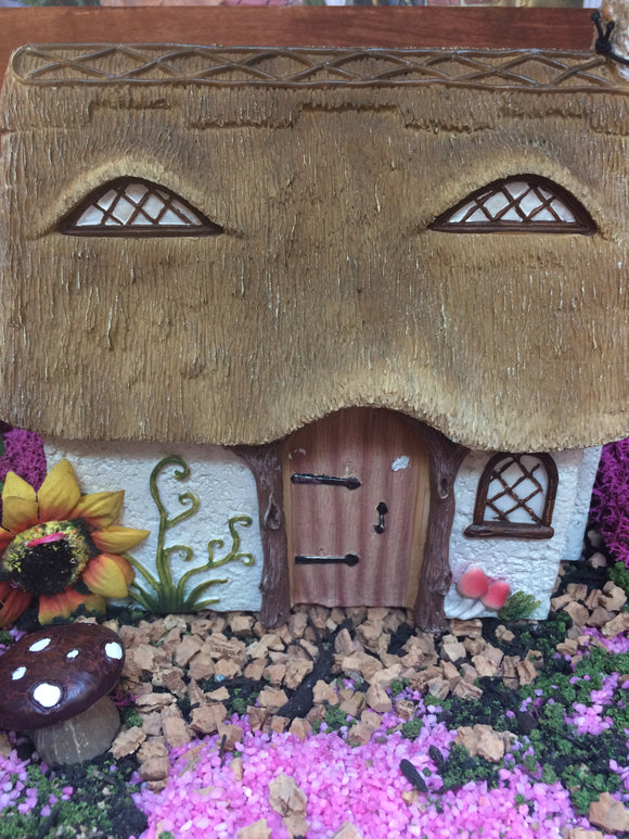 Thatched style fairy house