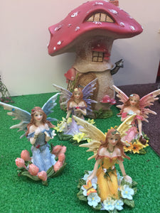 Four ceramic fairies