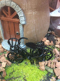 Tiny bike parked in a fairy garden