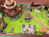 Fairy garden with teapot house