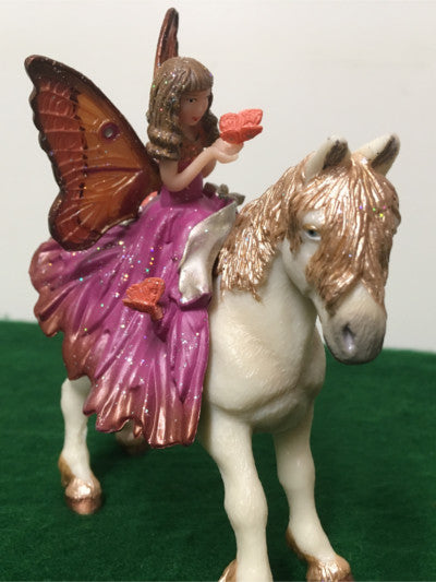 Fairy figure sitting on pony