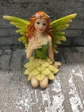 Green ceramic fairy with flowers in her hair