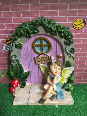 Purple door with sitting fairy
