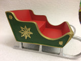 Red and green miniature sleigh scenic