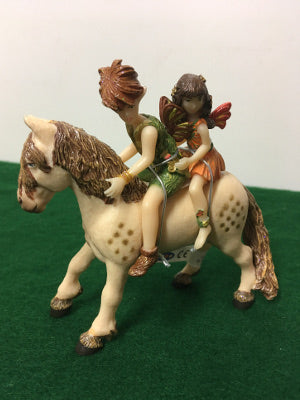 Two fairies on horseback