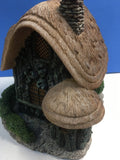 side view of thatched cottage