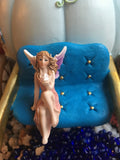 fairy sitting on carriage seat