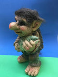troll figure with fish